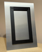 Load image into Gallery viewer, Back view of a 12 x 18 metal print with mount on a beige surface with a neutral background