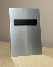 Load image into Gallery viewer, Back view of an 8 x 12 metal print with mount on a beige surface with a neutral background