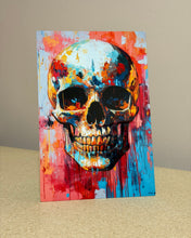 Load image into Gallery viewer, Colorful print of an abstract painting of a skull on a beige surface with a beige background