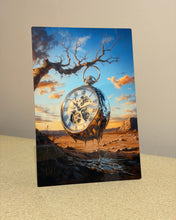 Load image into Gallery viewer, Colorful print of a pocket watch with a scenic background on a beige surface